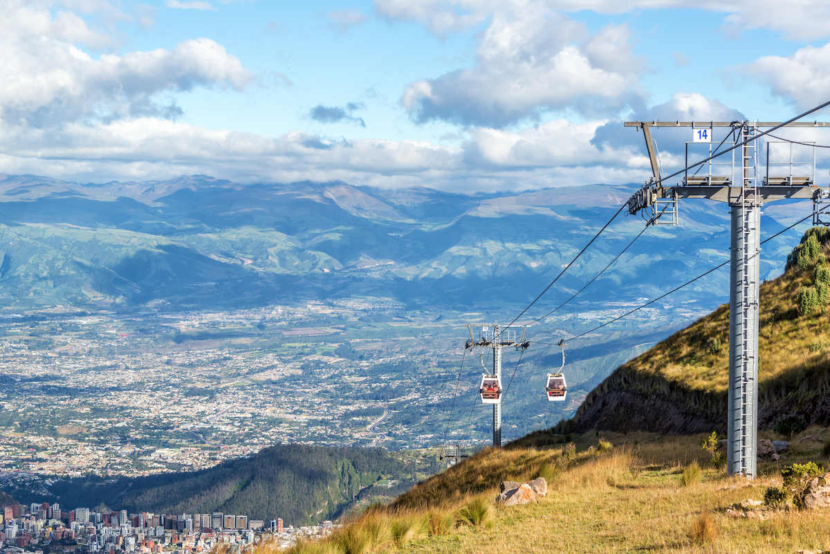 View of a gondola named the TeleferiQo climbing the Andes mountains outside of Quito, Ecuador