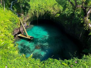 A beautiful sinkhole with a ladder leading to it in Samoa, To Sua Ocean Trench
