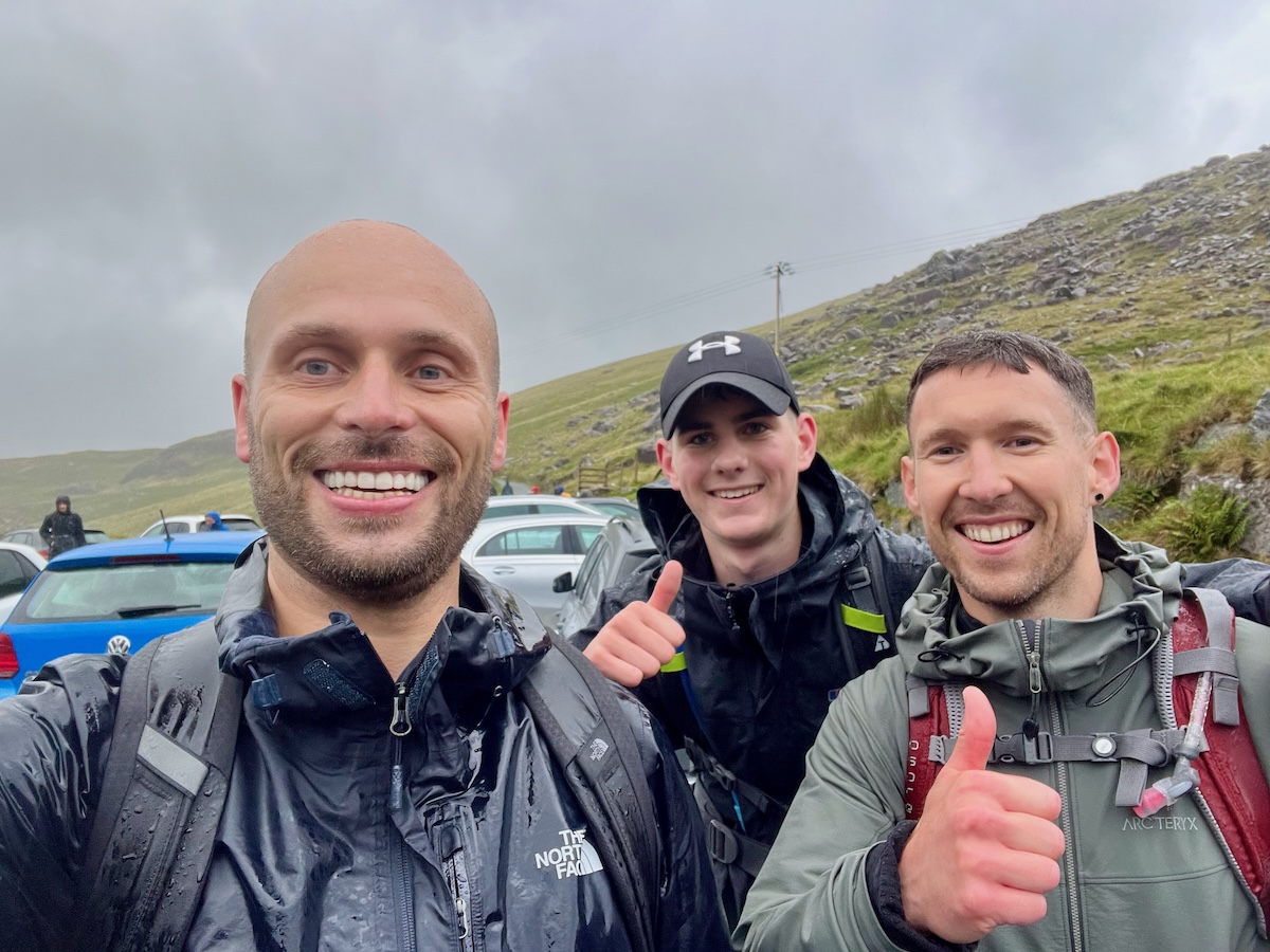 3 men smiling after completing the UK 3 Peaks challenge 