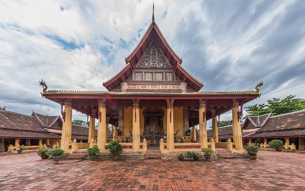 Wat Si Saket of Vientiane in its paved courtyard, under a stormy sky, in Vientiane, Laos
