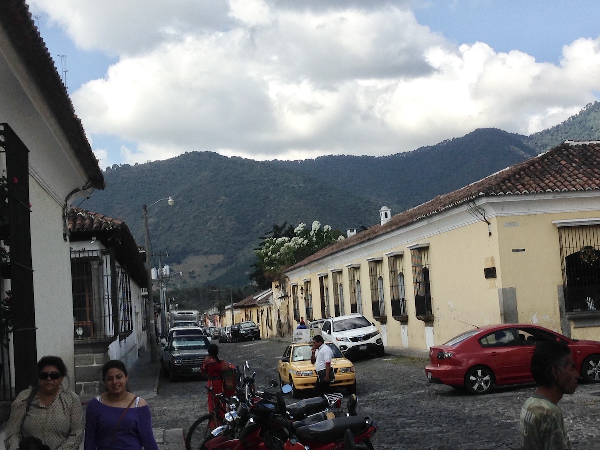 Spanish colonial buildings on a cobbled street in Antigua, Guatemala. 