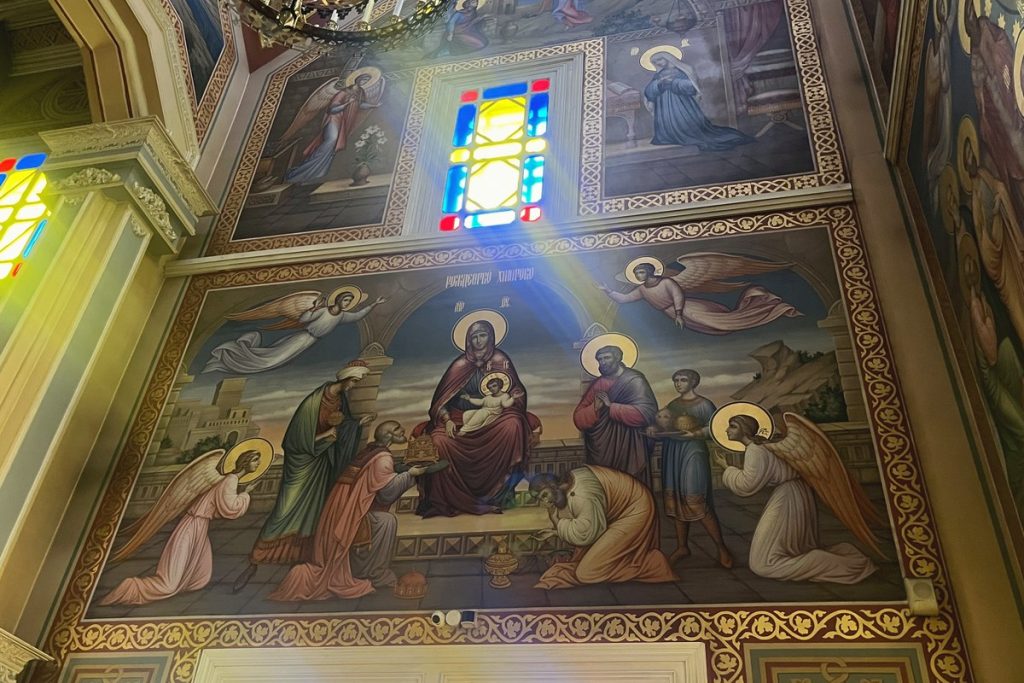 Painted ceiling frescoes and stained glass inside Ascension Cathedral, Almaty