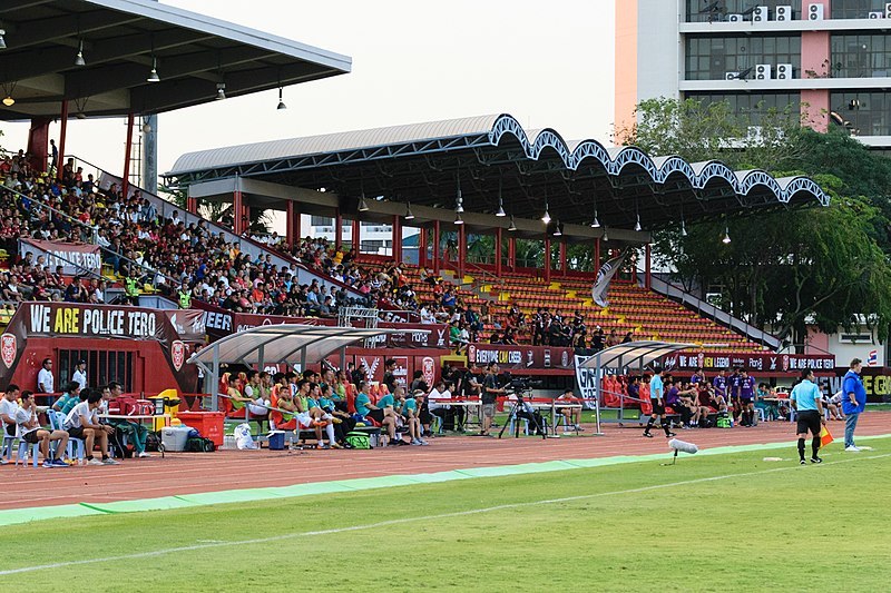 Spectators at a football match watch on in Bangkok, Thailand. 