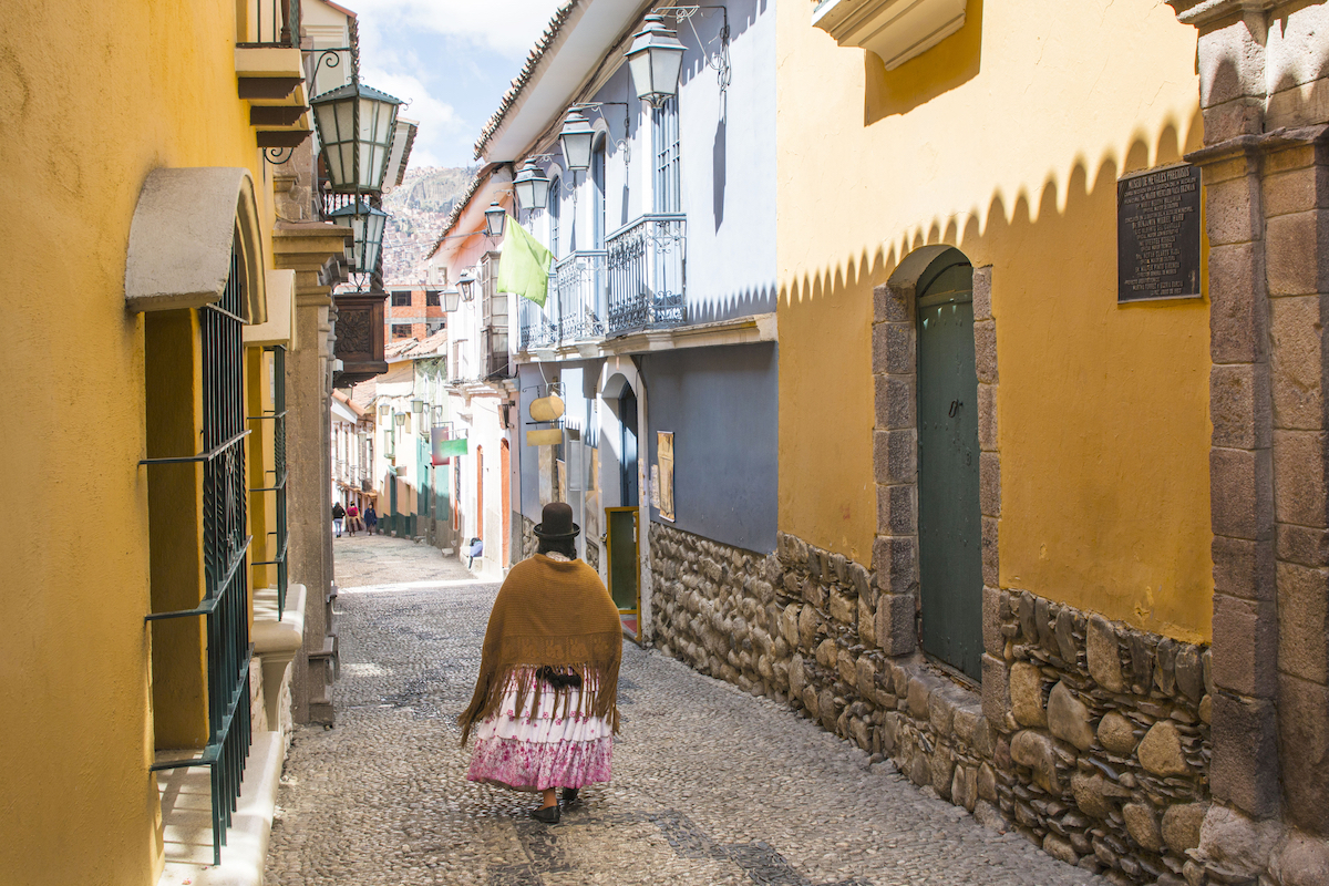 Jaen Street in La Paz, Bolivia city centre on a bright summer day. Cholita walking down the street