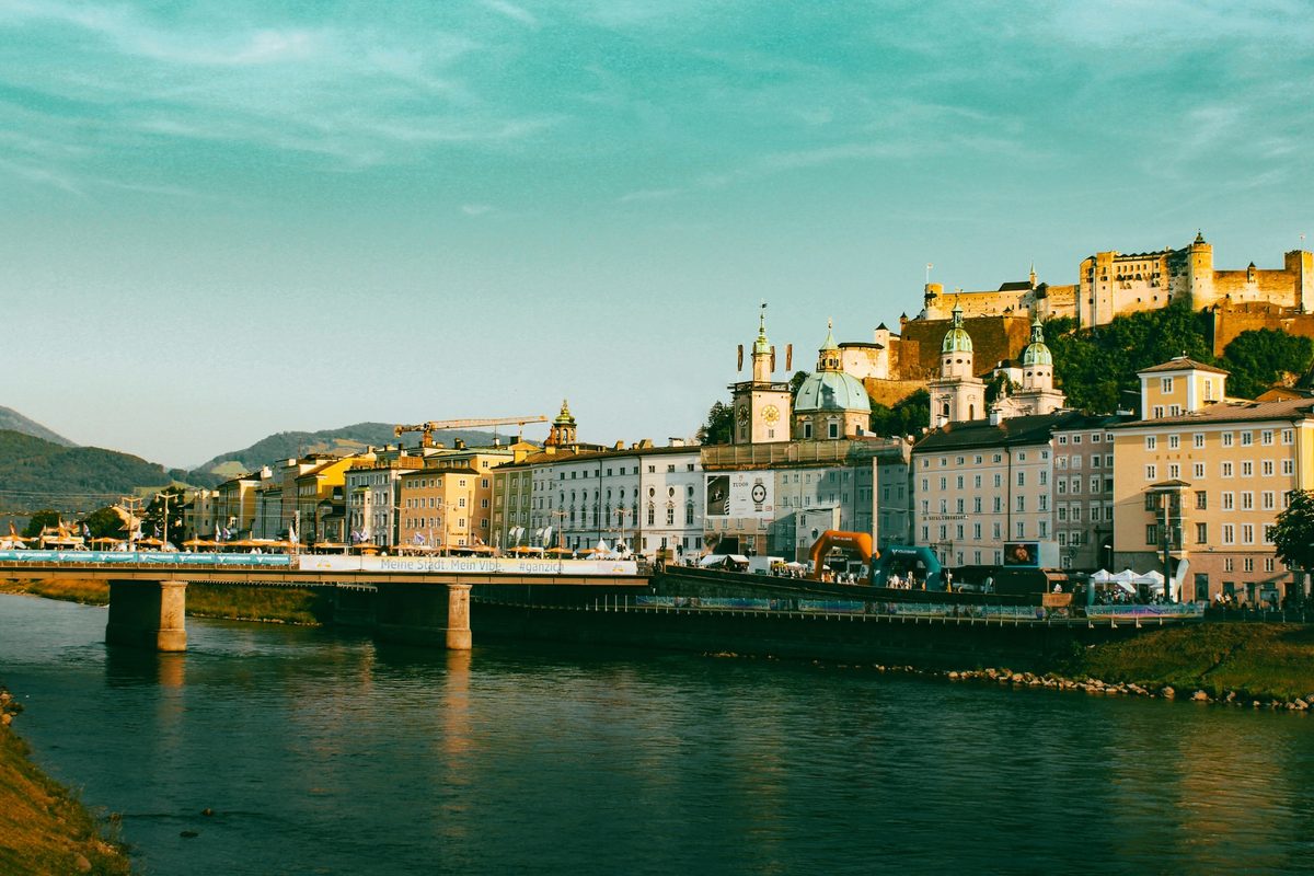 Austria's Best Day Trips from Vienna | cityscape with river bridge and castle on a hill Cityscape with river bridge and castle on a hill