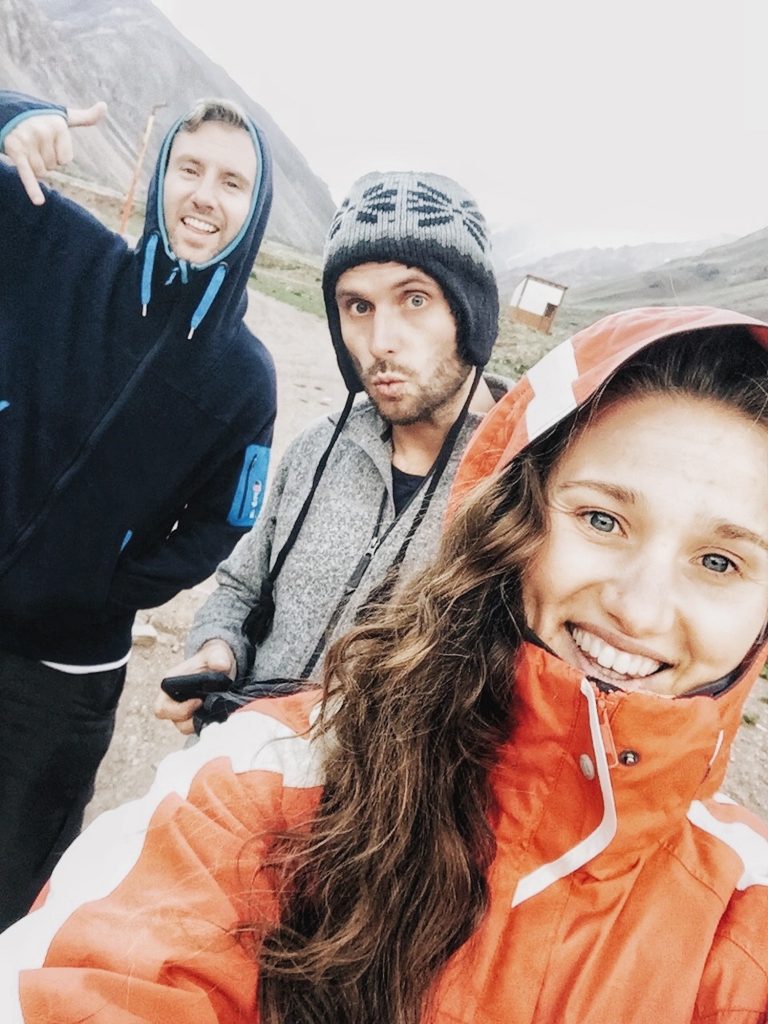 2 men and a woman stood outside on a cold night at Camp Confluencia on Aconcagua in Argentina