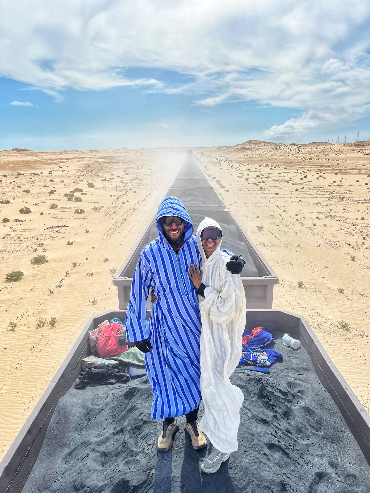A couple ride the iron ore train in Mauritania 