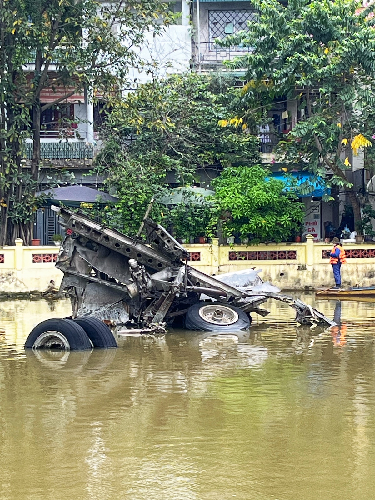 Wreckage of a downed B-52 lies submerged above Huu Tiep Lake River in Hanoi, Vietnam