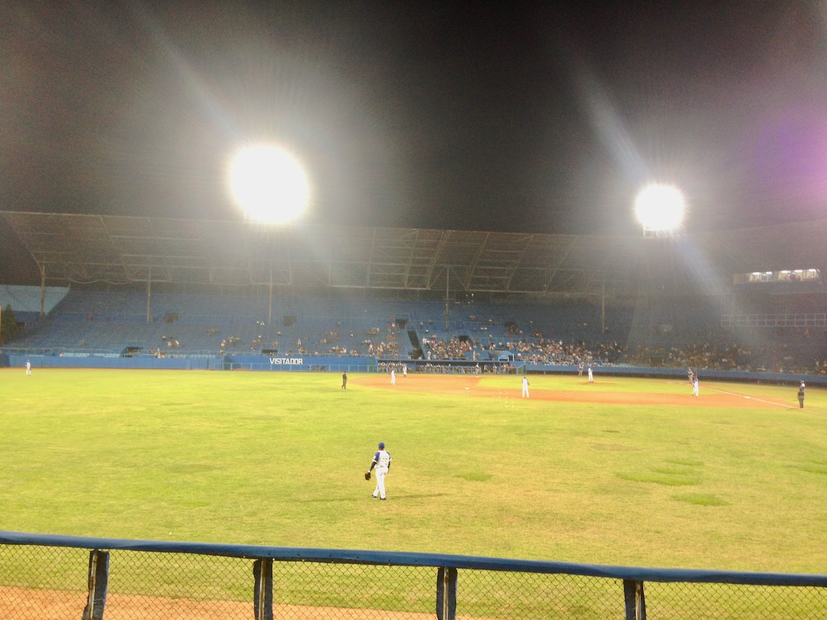 Baseball players on the field of The Estadio Latinoamericano in Havana, Cuba.