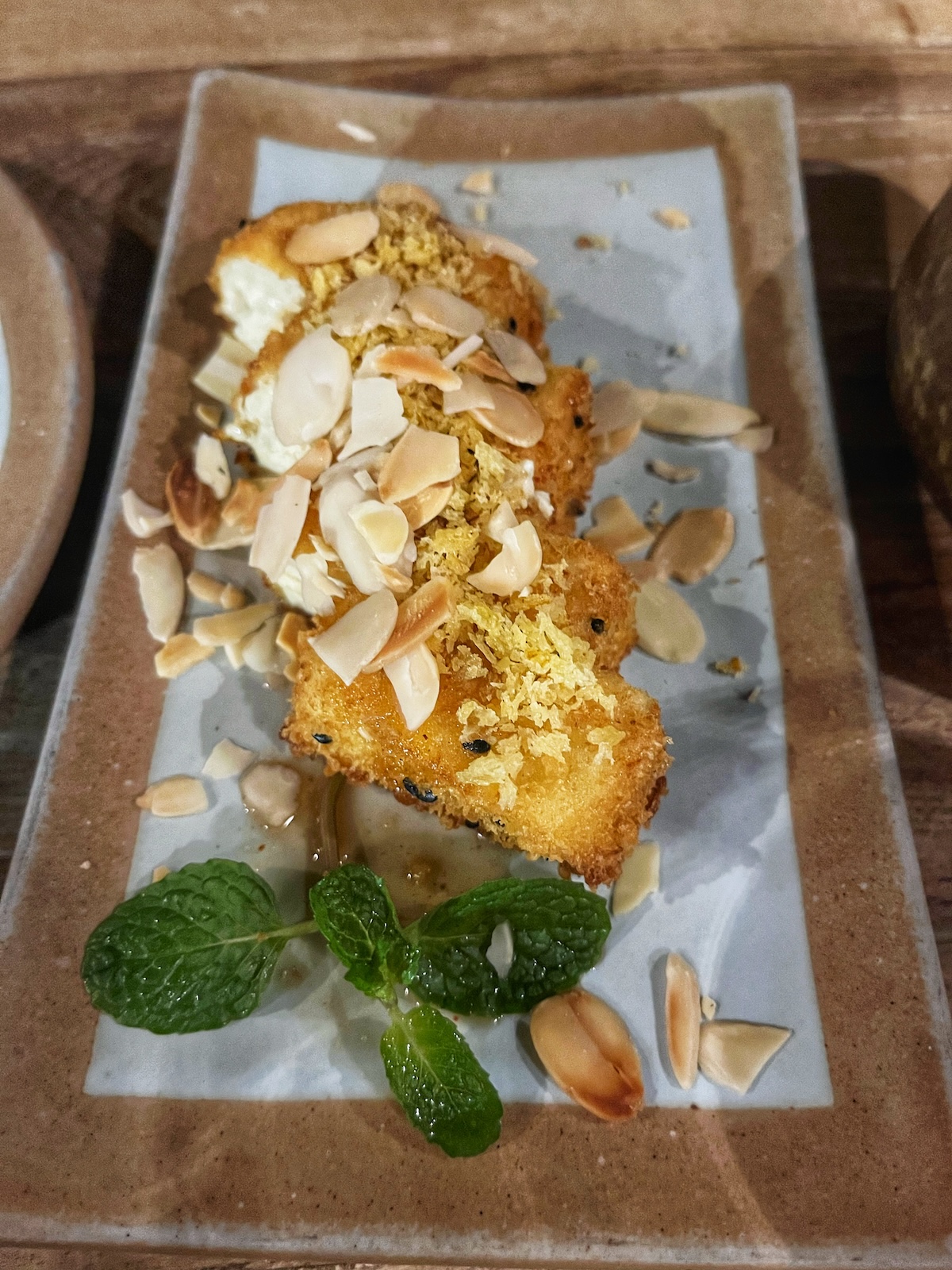 Chopped almonds on top of marinated tofu at Sadhu Vegetarian Restaurant, Hanoi