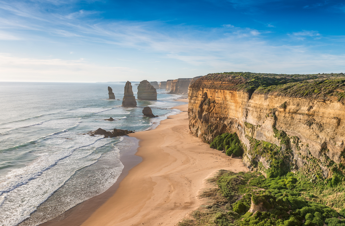 Cliffs overlooking the sea at sunset.