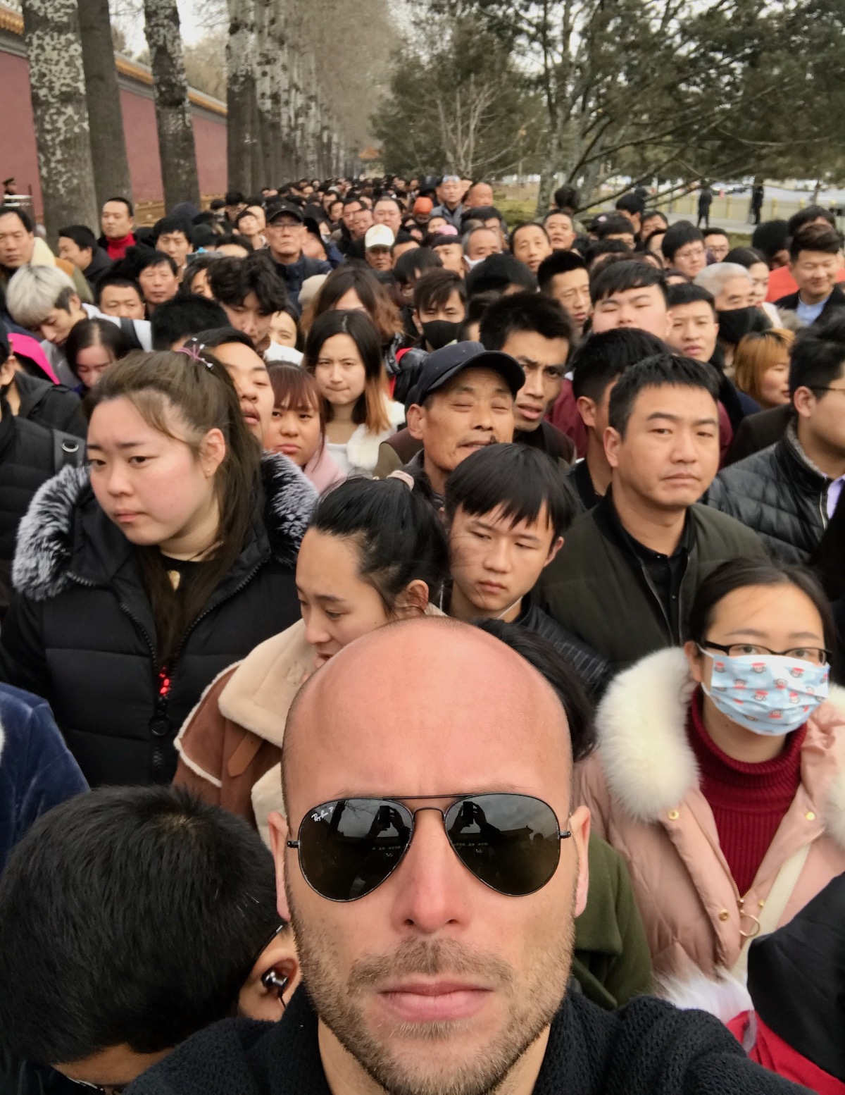 A tourist alone in a crowd in China 