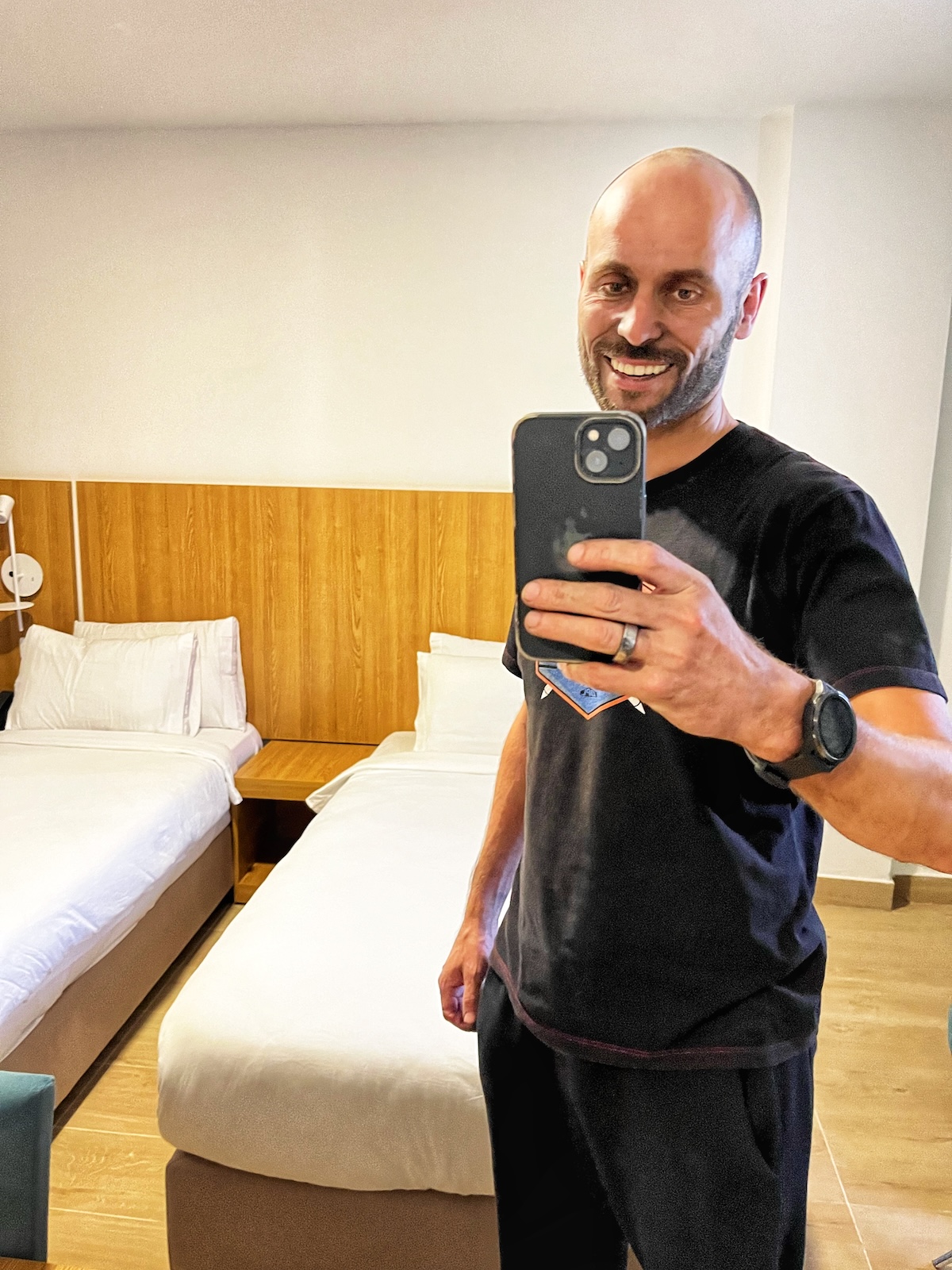 Man poses with dirty face in hotel room
