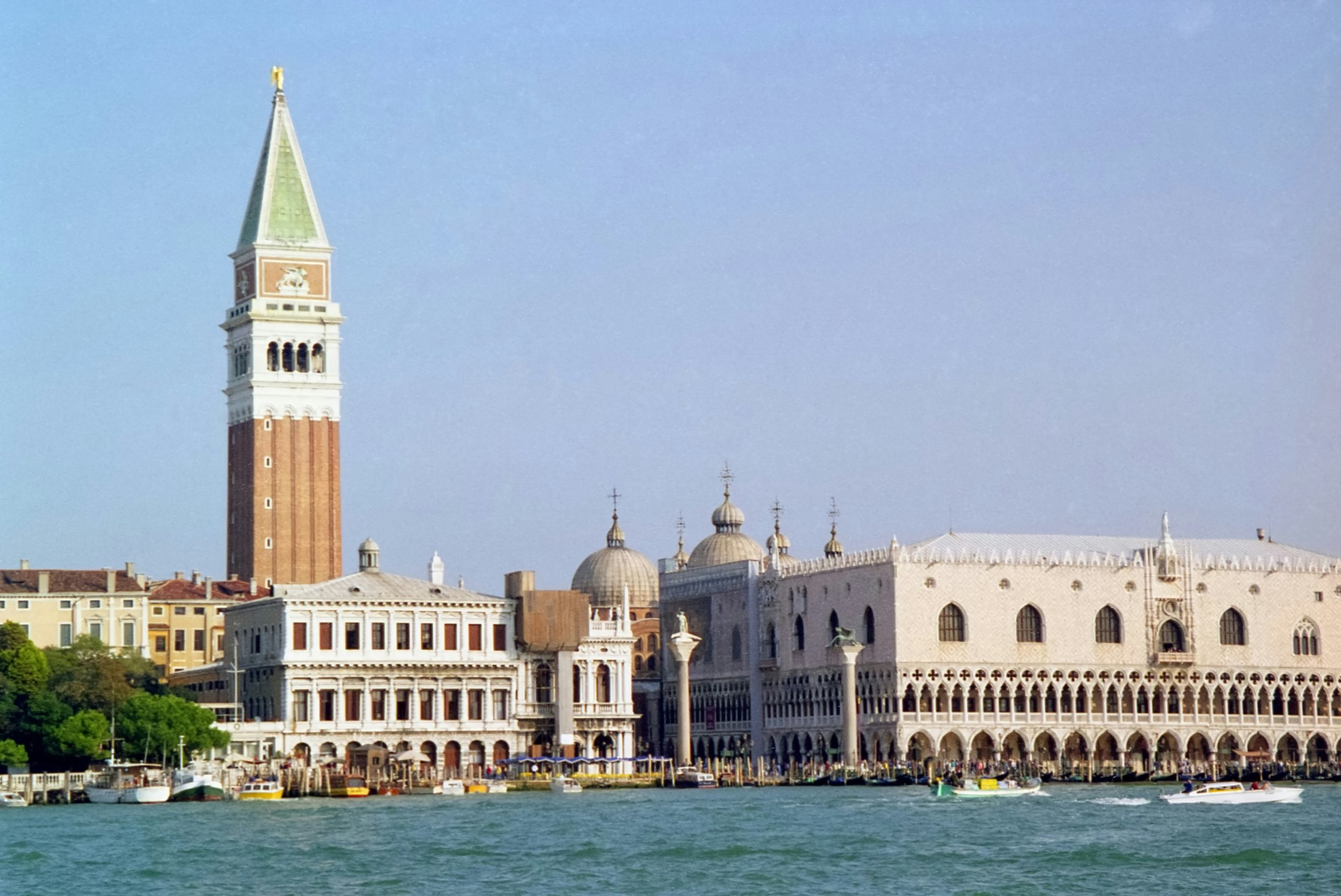 Azure Mirrors of Venetian Lagoon and Ancient Travertine of Colosseum: From Water to Stone