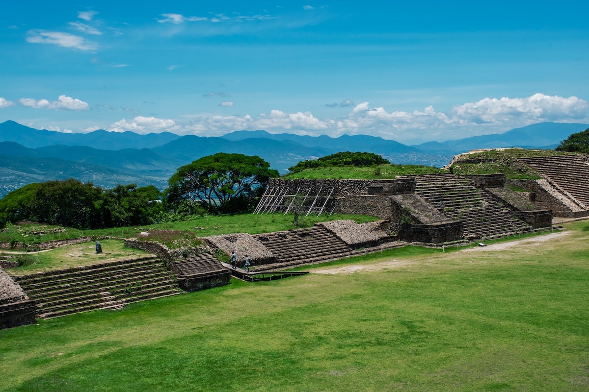 Ancient steps from a leftover building overlooking mountains.