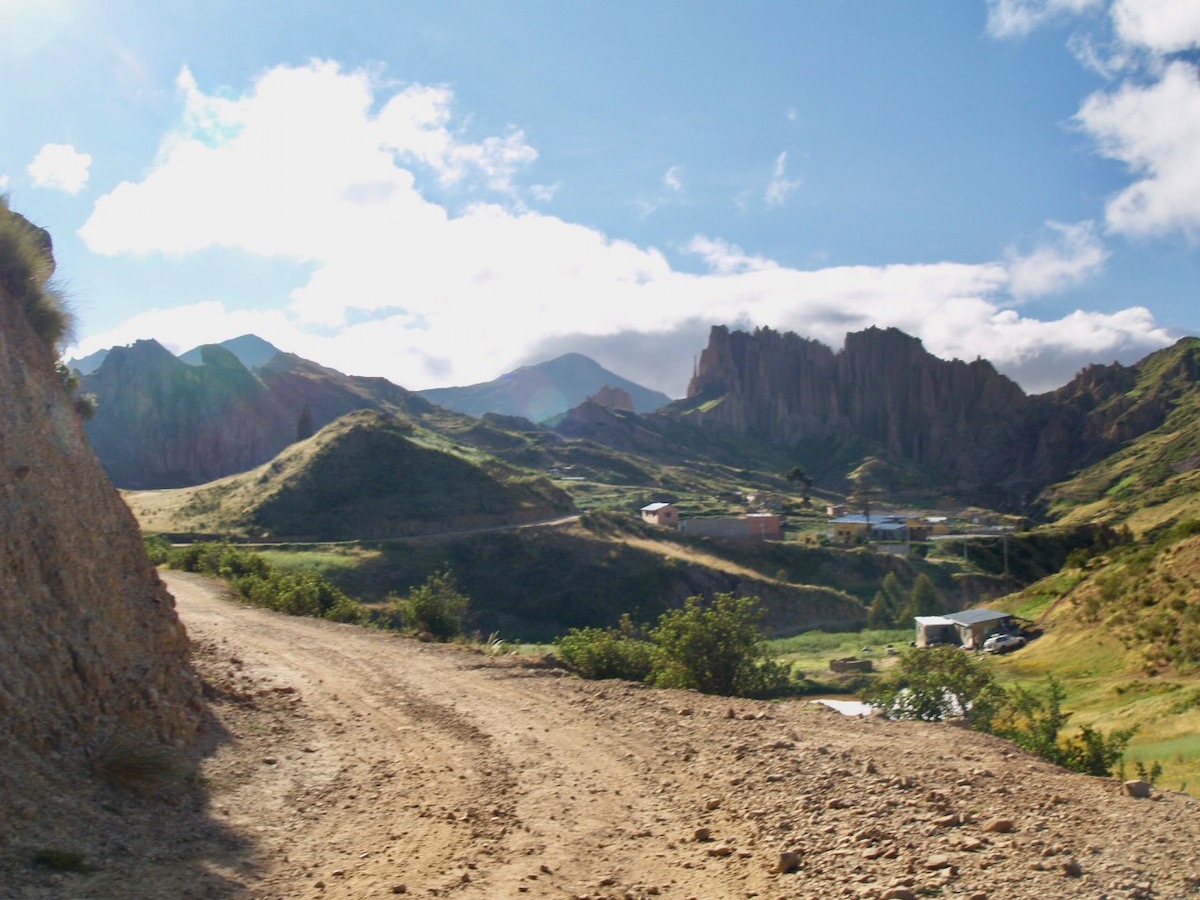 A landscape of greenery and mountains.