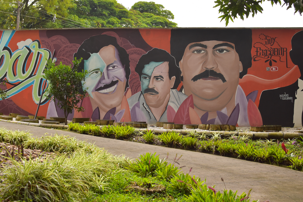Murals of Pablo Escobar on a wall.