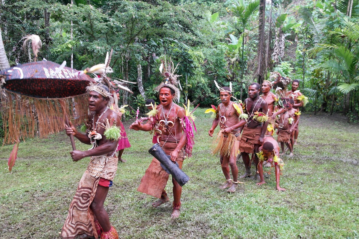 A tribe dances in the Papua New Guinea rainforest