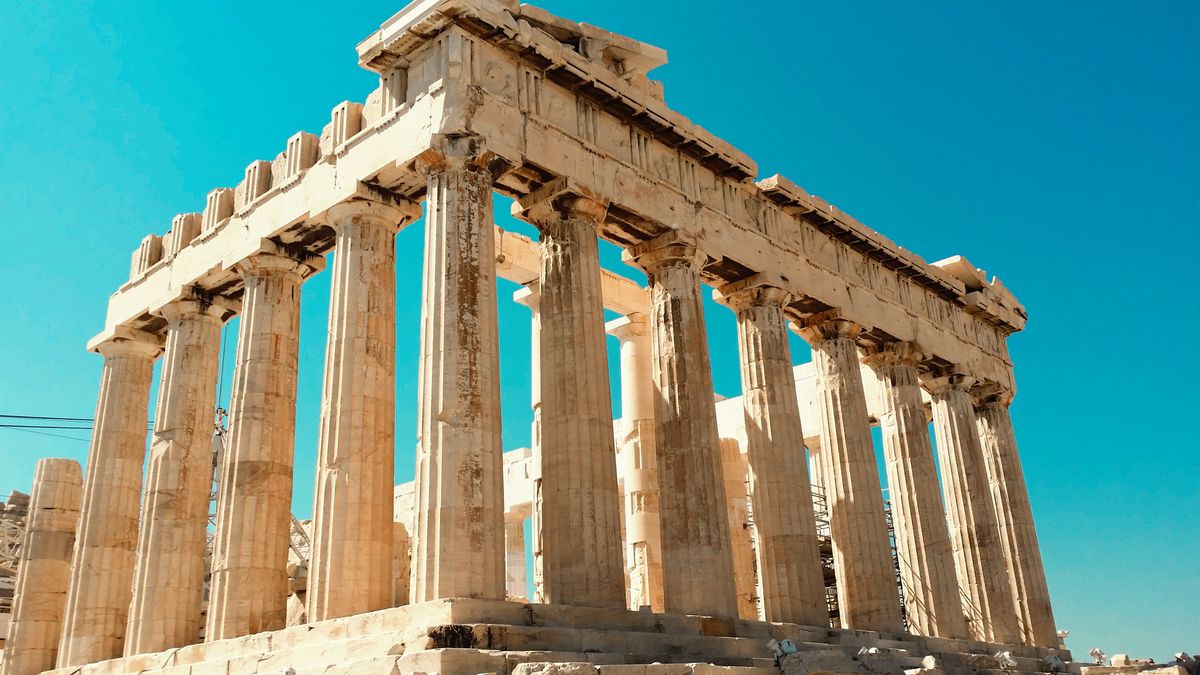 The Parthenon on the Acropolis in Athens against a clear blue sky