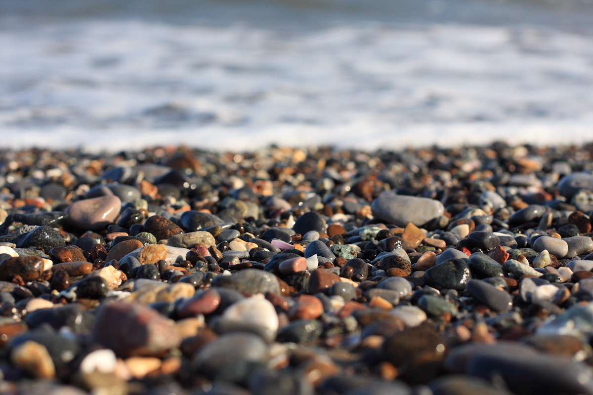 Pebbles lying on the shore of a beach