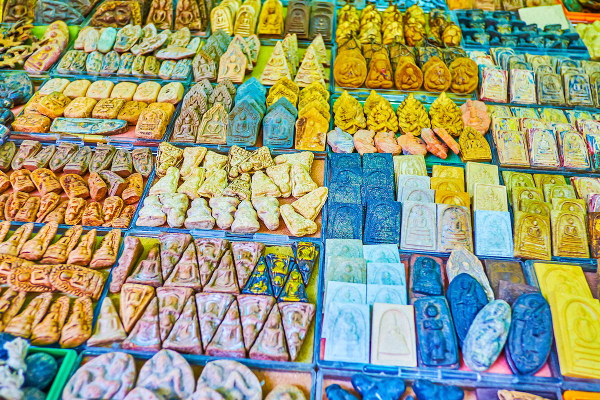 A variety of colourful amulets in Tha Prachan Amulet Market in Bangkok, Thailand