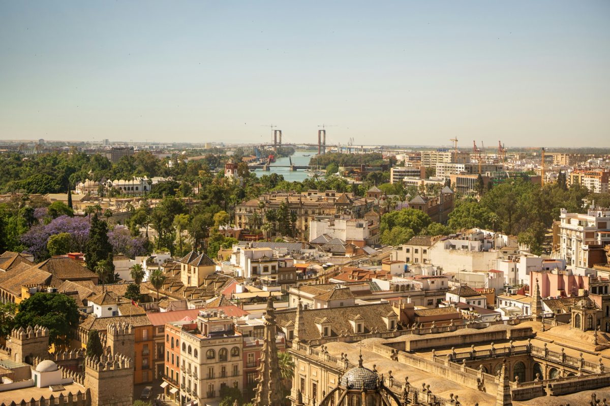 Budgeting for a Spain Trip: Costs Beyond the Plane Ticket | seville city view with river Seville city view with river