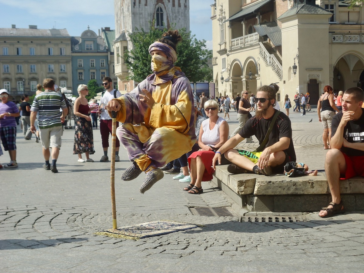 A levitating illusionist performs in the streets of Krakow 