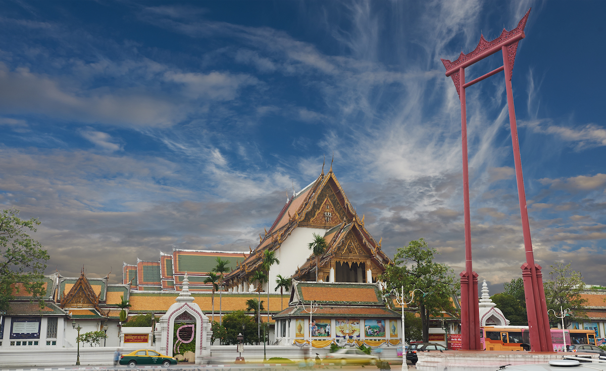The red giant swing of Bangkok towers over Suthat Temple