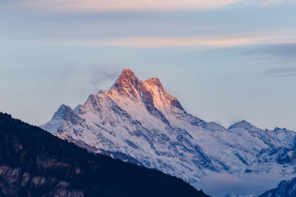 Trekking in the Alps: A Complete Guide to Routes, Safety, and Skill Levels | thomas buhler 5RydGpXvpxE unsplash 1 white and black mountains covered by snow under blue sky at daytime