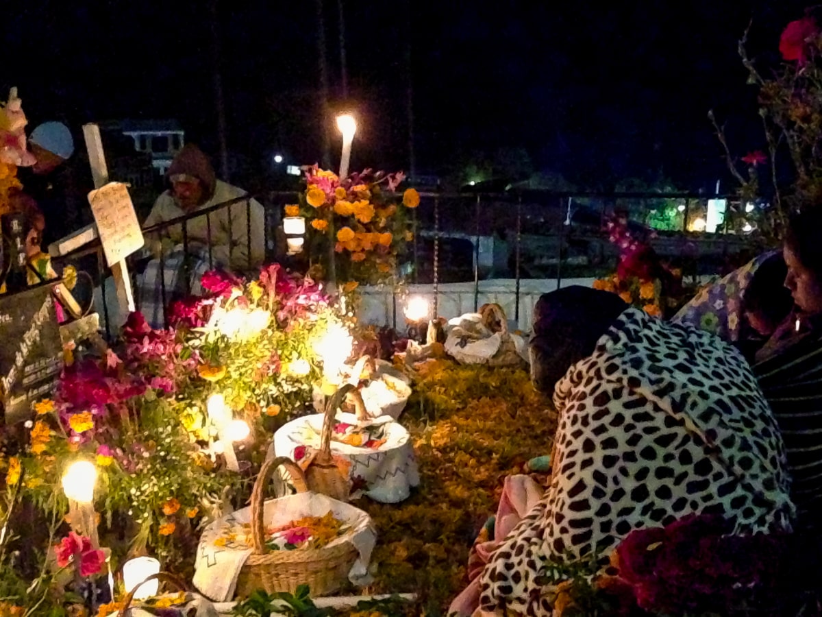 Woman at grave during Mexico's Die De Muertos 